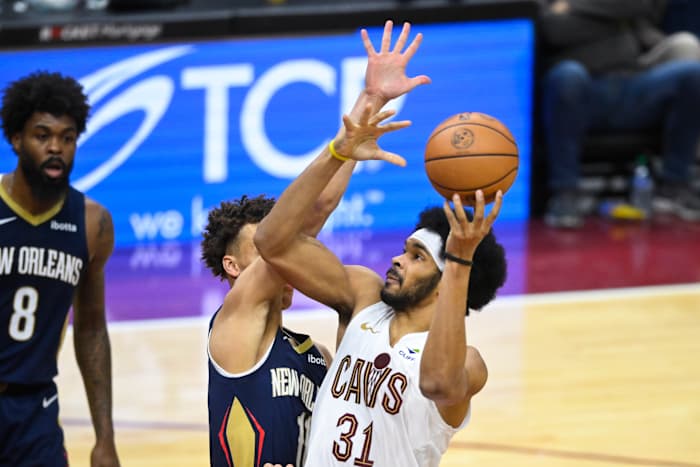 Dec 21, 2023; Cleveland, Ohio, USA; Cleveland Cavaliers center Jarrett Allen (31) shoots the ball as New Orleans Pelicans guard Dyson Daniels (11) defends in the fourth quarter at Rocket Mortgage FieldHouse.